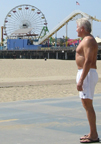 Bill in trunks in front of Santa Monica pier - profile
