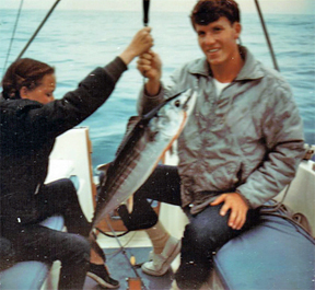 Melinda O'Brien helping Bill Holmes with bonita on Cal 20